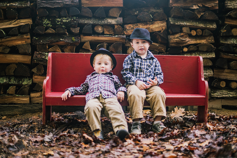 two-young-boys-in-plaid-on-red-bench