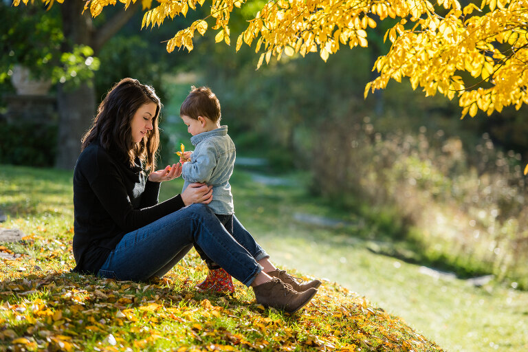 mother-and-son-examining-fall-leaves