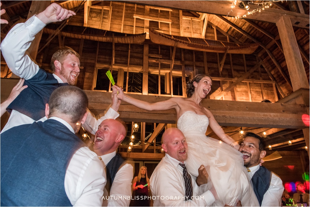 maine-wedding-photography-bride-groom-hoisted.jpg