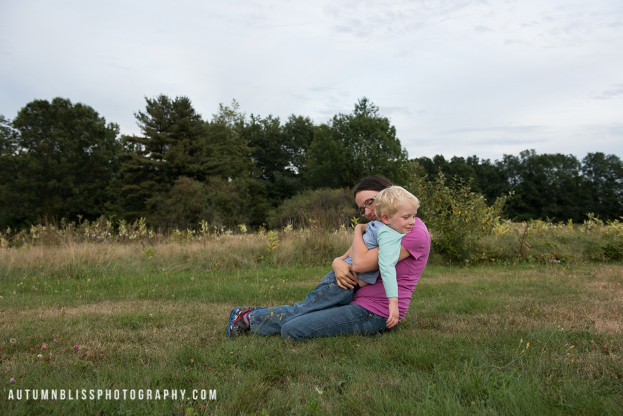 mom-hugging-reluctant-son