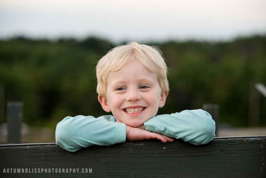 young-boy-posing-on-wagon-closeup-nh-photographer