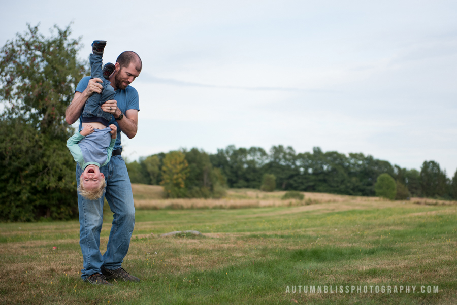 father-tipping-son-upside-down