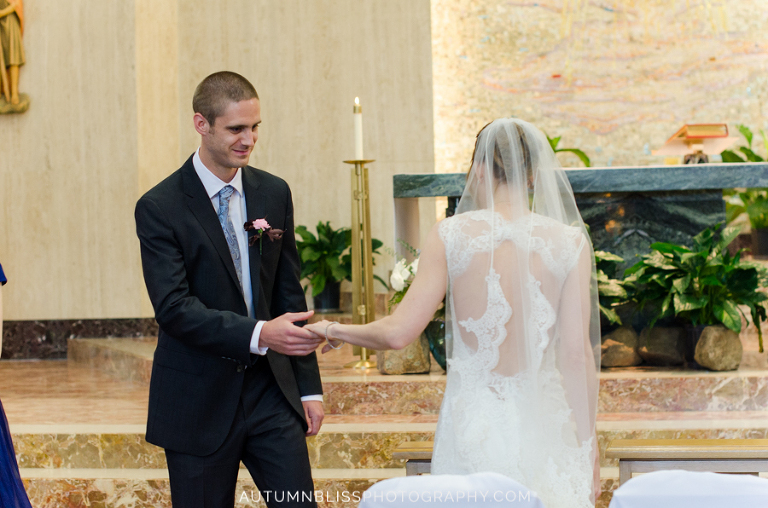 groom-helps-bride-up-altar-st-christophers-church-york-maine