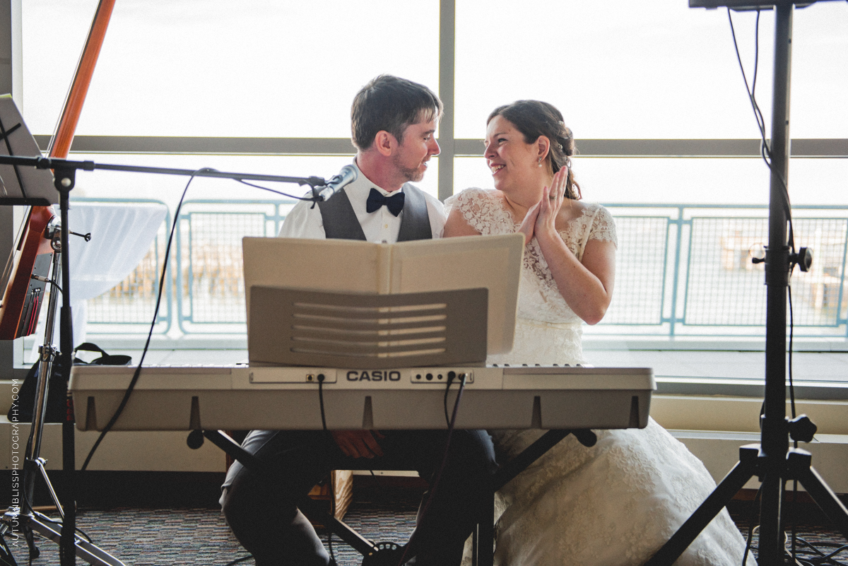 wedding-couple-sitting-at-electric-piano