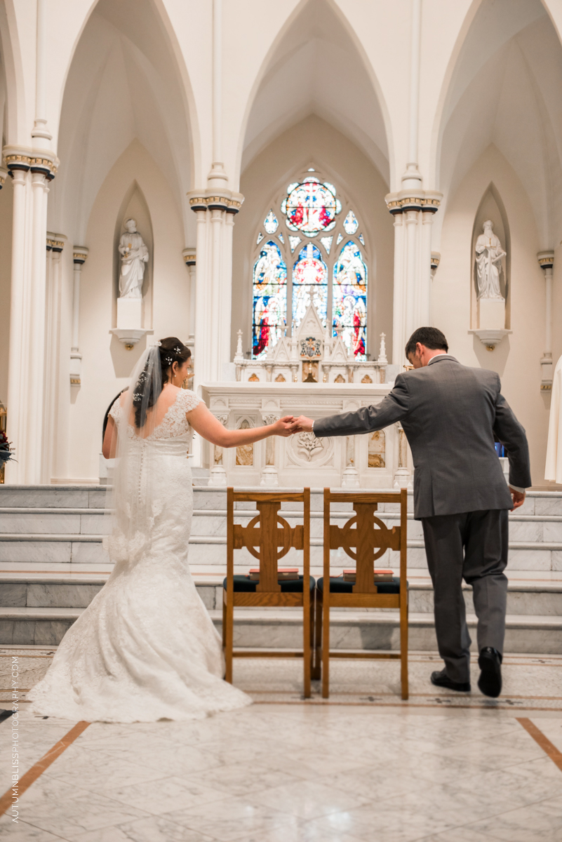 wedding-couple-sitting-down-at-church