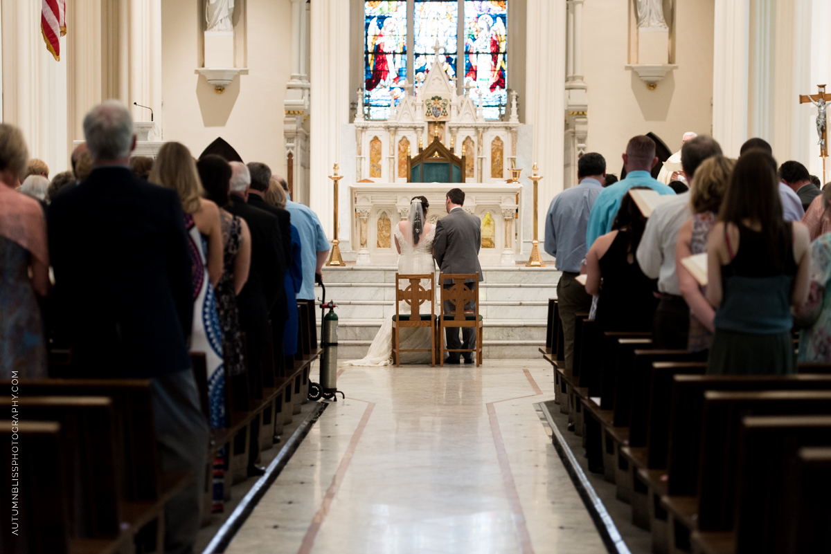 wedding-couple-at-altar-catholic-church