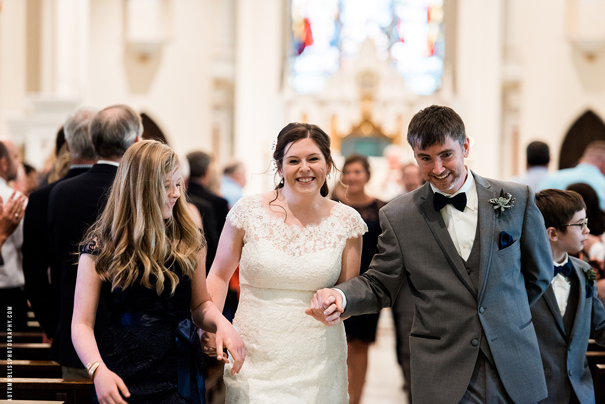 wedding-couple-and-their-children-walking-down-aisle