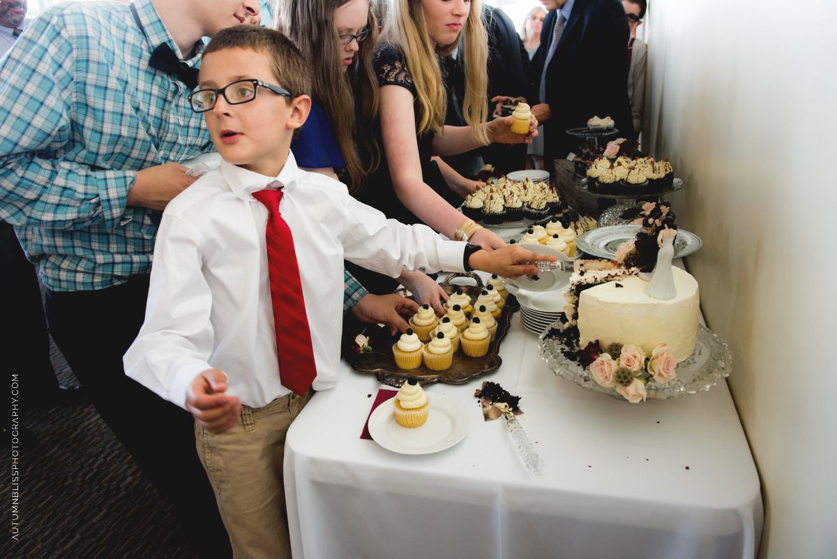 young-guest-cutting-wedding-cake